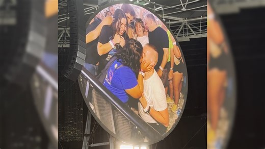 A sign at Coldplay's Wembley Stadium show read, “I want to propose [to] her." Chris Martin then serenaded their proposal with an improvised song, while alluding to the "kiss cam" scandal from their concert in July. | Lubbock Avalanche-Journal