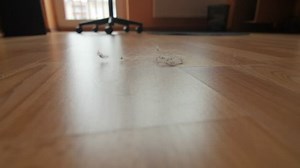 Vacuuming a mess floor.