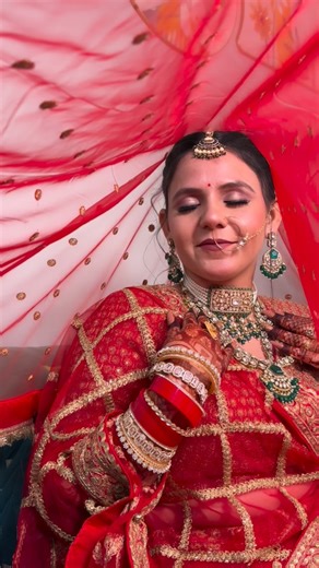 Infinite Glow - Makeup l Beauty l Hair on Instagram: "A regal red bridal dream brought to life — luminous dewy skin, soft nude lips, and glitter-kissed eyes that speak grace in every glance. Designed for brides who want to glow, not just shine, this look celebrates timeless beauty with a modern soul. Delhi brides, your wedding glow begins here. Bookings are now open for the wedding season — DM for inquiries & availability ❤️👰‍♀️ #DelhiBridalMakeup #RedBrideLook #DewyBridalGlow #LuxuryMakeupArti