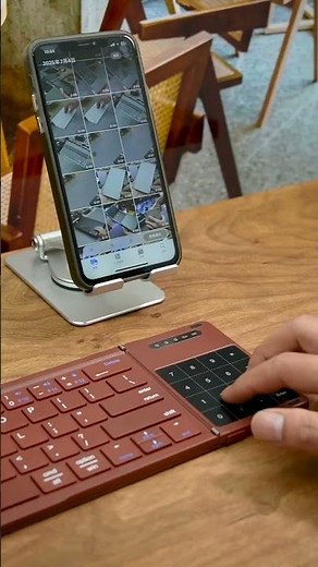 Have you ever seen a foldable keyboard with a built-in touchpad and small numeric keys?