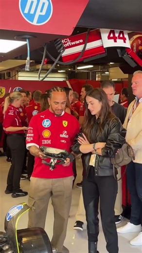 Ana de Armas and Lewis Hamilton in the Ferrari Garage