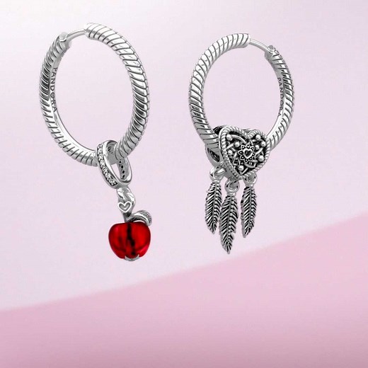 Pandora must-have 🙌 Hoop earrings styled with up to three charms — a new way to wear your favorites. Shop now: go.pandora.net/3zyXeah | Pandora