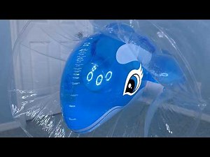 Blue Whale Pool Toy Gets Suspended Inside Giant Inflatable Squeezer