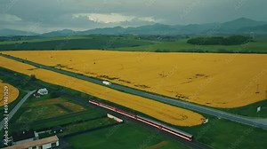 Drone captures the UK countryside, from farms to fields to a winding country road.