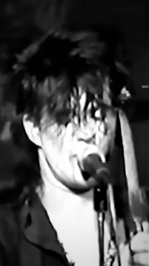 Ministry of Cults on Instagram: "Skinny Puppy – “Assimilate” Live at Dolce Vita, 1986 Captured at the height of their early industrial assault, Skinny Puppy performing “Assimilate” at Dolce Vita in 1986 stands as a defining document of the band’s confrontational live presence. By this point, cEvin Key and Nivek Ogre had already established a reputation for shows that blurred the line between performance art and sonic punishment, and this appearance only cemented that legacy. “Assimilate,” origin