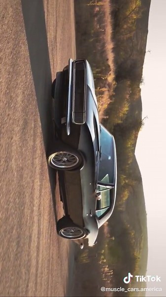 Classic Black Camaro Showcased in Scenic Drive