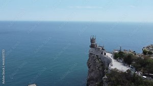 Crimea Swallow's Nest Castle on the rock over the Black Sea. It is a tourist attraction of Crimea. Amazing aerial view of the Crimea coast with fairytale castle above abyss.