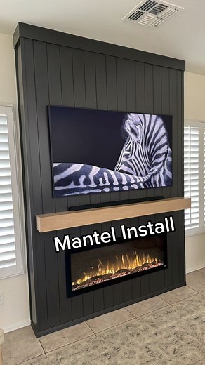 506K views · 2.1K reactions | It really pained me to drill a hole in the nice fireplace we just finished, but it had to be done! This mantel really sets this piece over the top and the job is finished! DM to get your electric fireplace buildout quote today (Arizona Only). #howto #inspo #livingroomdecor #electricfireplace #installation #designideas #woodworking #builder | Accent Wall Designs | Facebook