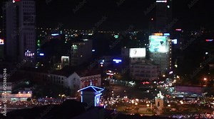 Saigon traffic by night.Crowded streets with an unusual flow of never ending moped traffic.