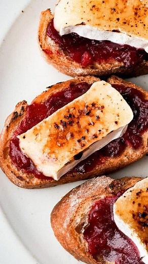 These cranberry brûléed Brie crostini by Whisper of Yum are a simple sweet and savory appetizer you need to have at your upcoming holiday party! https://whisperofyum.com/post/cranberry-and-bruleed-brie-crostini/ | Tasty