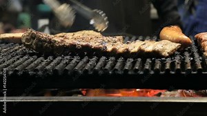 Thai street vendor sells grilled meat at street market in Thailand. Close up