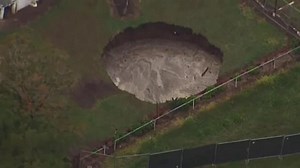 Large sinkhole opens in Australian couple’s backyard