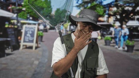 clip-4047360165-man-fisherman-holding-fishing-net-covers-mouth