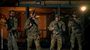 at a professional shooting range military trainers perform tactical exercises with NATO assault rifles