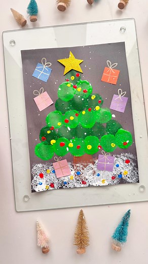 Mandisa | Happy Toddler Playtime on Instagram: "Did you know you can create a festive Christmas tree using sponge circle printing? ✨ Cut sponges into circles, dip them in green paint, and stamp onto paper to form the shape of a tree. Decorate with qtip painted dots and presents. It’s a fun and creative holiday craft for kids! #ChristmasCraft #SpongePainting #CreativeKids #HolidayFun"