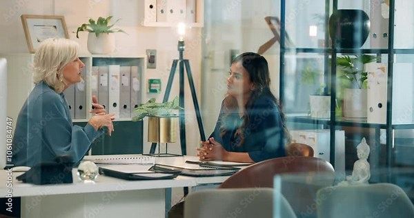 Business, women and discussion of interview in office for job vacancy, b2b meeting and onboarding information. People, talk and recruitment process, hiring questions and human resource of opportunity