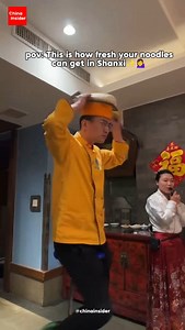 Noodles are a staple of Chinese cuisine, and nowhere is that more true than in Shanxi Province—often called the “Kingdom of Noodles” 🍜. With over 260 types of noodles, Shanxi is legendary for its rich noodle culture. One of the most iconic is Daoxiao Mian (刀削面), or knife-cut noodles 🔪. These thick, chewy noodles are shaved directly from a block of dough into boiling water using a special curved knife. It takes serious skill and lightning speed ⚡—each slice must be even and smooth. The result? 