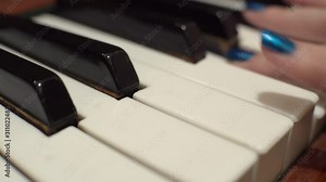 woman plays the old piano, top view and side view, close up, fingers press the keys.
