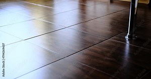 Robot vacuum and mop cleaner cleans around furniture indoors and changes direction of moving automatically using it's sensor.