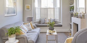 This multi-purpose living room functions as an efficient home office