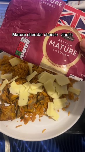 Jollof rice and cheese! The correct way to enter the new year #jollofrice #aholic