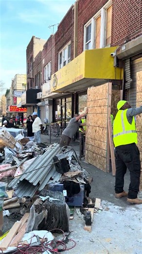 Spartan Demolition Company boarding up fire damaged property