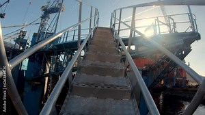 Walking up steel gangway ladder to shipyards drydock