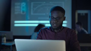 Man drinking coffee in front of the computer - Free Stock Video