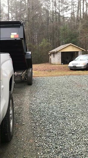 Gravel spreading using dump trailer