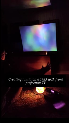 Have you ever seen one of these? 'big screen' front projection TVs had a short lived hay day in the early and mid 80s. I found this one a few years back on marketplace and had to check it out. Find out you can just convert to rca and send a modern signal into it. Sweet. Here's one of those experiments. #interactive #lightart #lightartist #retro #touchdesigner