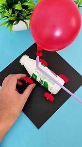 87K views · 3.1K reactions | Turn a plastic bottle into a speedy balloon-powered car! Insert two sticks through the bottle to act as axles, then attach bottle caps as wheels. Secure a balloon to a straw, tape it on top, and inflate it through the straw. Let it go and watch the car zoom forward using air power alone! A fun, hands-on experiment kids will love—it’s science, creativity, and play all in one! #parents #parenting #craft #CraftWithKids #DIY #diykids | Paper Craft Ideas | Facebook