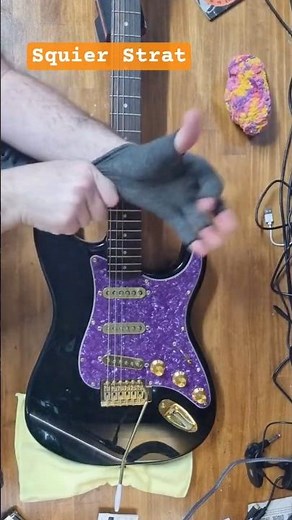 Heavily modified Squier Strat with Gold hardware and a purple pickguard #squier #guitarcommunity