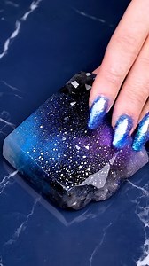 Space doesn’t disappear…it melts into texture. Deep indigo, cosmic violet, and shimmering astral motion the stone becomes stardust ribbons in front of your eyes. Follow Nikkie Burns Digital Creator for celestial textures that soothe. Comment “AURORA” for the link to my Aurora Alchemy prompt guide! #galaxy #asmr #explore #reels #oddlysatisfying | Nikkie Burns Digital Creator