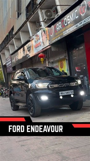 Car Cosmic Goregaon on Instagram: "From a bold red to an iconic black, this Ford Endeavour has undergone a complete color transformation. The new black wrap adds depth, dominance, and a timeless luxury appeal, turning every drive into a powerful statement on the road. . . . #carzcosmec #paintprotectionfilm #mumbaicars #ceramiccoating"
