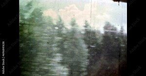 Spruce forest in motion on blue cloudy sky background. Green forest nature in summer moving. Natural pine landscape. Travel in scenic woods. 4k vintage footage of overscan archival film. 1980s archive Stock Video