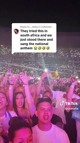 South Africans Sing National Anthem at Concert