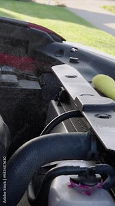 spraying and cleaning engine compartment of car-suv vertical video