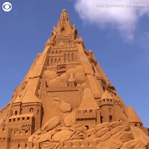 55K views · 11 shares | WORLD'S TALLEST SANDCASTLE: Here's a look at the new Guinness World Record holder for tallest sandcastle. It is in Denmark and is nearly 70-feet tall. The designer says the sandcastle has a COVID-19 theme, including a crown "because it is ruling our lives everywhere." | CBS Newspath | Facebook