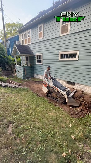 Custom patio and walkway using Techo-Bloc Blu60 smooth pavers in Shale Grey and a Villagio border in Onyx Black 😎 📲 Call/text us at 315-481-0963 to set up a free estimate! #hardscape #hardscapedesign #outdoorliving #homeimprovement #syracuselandscaper | CNY Turf