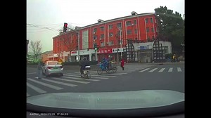 Angry motorist sticking middle finger up at another driver crashes into crossing motorcyclist
