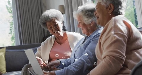 clip-3999309537-retired-friends-tapping-laptop-when-envelope-icon