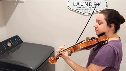 Violinist Performs a Beautiful Duet With the Musical Alarm on Her Washing Machine