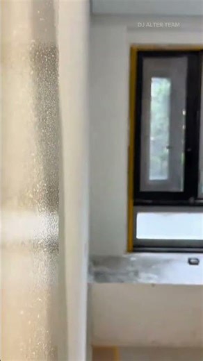applying paint to wall using a textured roller to create a smooth surface and renovate home interior