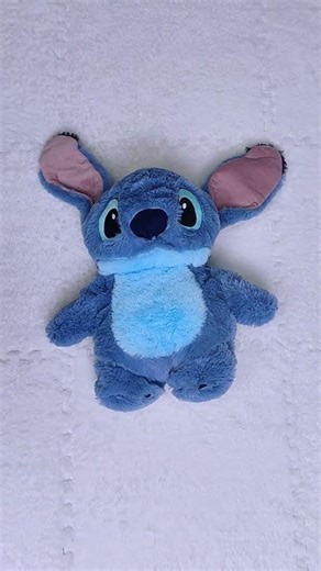 Fictional_blue_alien_Stitch_from_Disney_universe_giving_special_gift_in_funny_scene