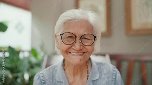 Happy Asian elderly woman wearing denture smilling to camera. Grandmother using dental prosthesis. Insertion of dentures. Dental concept. Flexible nylon denture