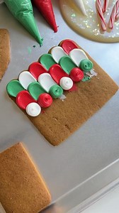 One of the best parts of the holiday season is decorating gingerbread houses. I always make extra gingerbread to eat because it’s so flavorful. Do you make gingerbread every year? #christmascookies #royalicingcookies #decoratedcookies #cookiedecorating #gingerbreadhouse | Butterfly Bakes ATL