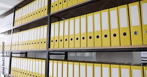 Office yellow folders on shelf in office. Archive documentation