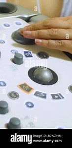 Modern ultrasound device. Ultrasound examination of internal organs. A woman undergoing an ultrasound scan of her abdominal cavity. Ultrasound examination device - vertical video Stock Video Footage - Alamy