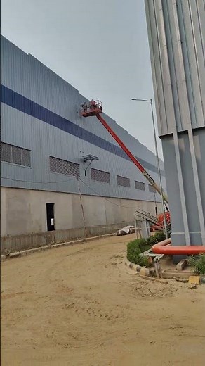 Cage ladder installation in peb building warehouse