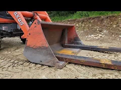 Kubota BX, backhoe working and homemade FEL bucket Pallet Forks.